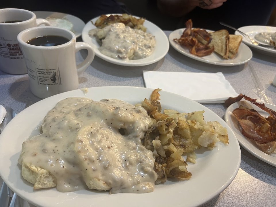 Comfort food plates on a diner table.